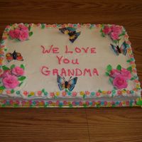 Family Reunion Choc cake with bc, gumpaste roses, small fondant flowers wafer butterflys.