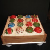 Holiday Ornaments 16x16 double layer cake with cake ornaments. Fondant "wood", butter cream ornaments with dragees and royal icing dusted with...