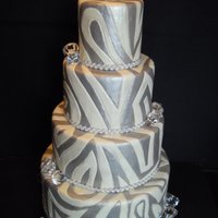 Bling I love this cake. All glam. It's covered in white fondant. I pressed the pattern is as you would to do quilting. then I painted with...
