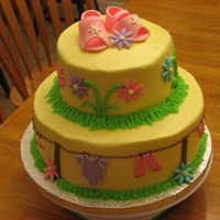 Clothesline Baby Shower Cake Copied the design straight form here, thanks everyone! Buttercream with fondant accents. Sandals are fondant/gumpaste.