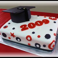 Graduation 2009 Marshmallow Fondant cake with Italian Butter cream filling that measured 11 x 15 " with a 6" round grad hat on top. The top of...