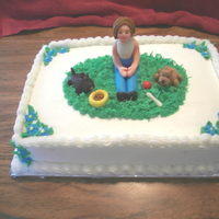 Friend And Her Dogs yellow cake, buttercream icing, rolled buttercream figures, all edible.