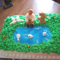 Fishing Cake 2 yellow cake, buttercream icing, rolled buttercream figures, raw spaghetti fishing pole