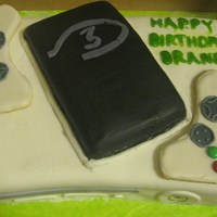 Xbox 360/halo Cake Whtie fondant, sugar cookie controllers. Made for my step son's birthday.