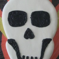 Ghost Rider Cake White fondant with black buttercream features. The background is just cardboard on a cake board. Made for my brother's birthday.