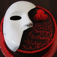 Phantom Of The Opera Cake French vanilla cake with fudge frosting. The mask is plastic, but everthing else is edible. The borders are done with rolled buttercream....