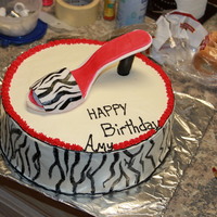 Shoe Cake cake made covered in buttercream, shoe make of gumpaste