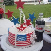 4Th Of July Spice cake with bc icing, stars are from roll out cookie dough (wilton) 3 of the cookies broke on the way and the wind was blowing but all...