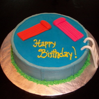 Pool Birthday 12 inch round iced in butter cream with fondant floats and ladder.
