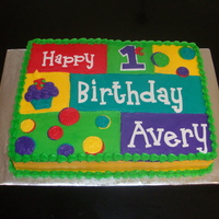 Avery's 1St Birthday 11 X 15 sheet cake iced in butter cream with fondant letters to match napkins and plates for party.