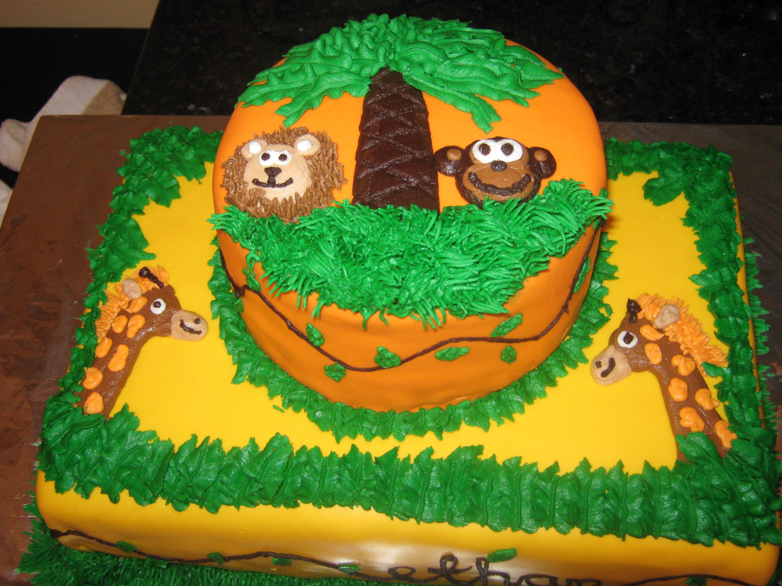 Jungle Cake 1/4 sheet cake (3 layers cream cheese pound cake) and 6" round (3 layers carrot cake) with buttercream frosting and MMF. All...