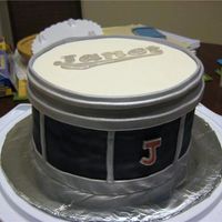Janet's Drum Cake Made this for a coworker's wife. She is in a marching band and I made it from a picture of her actual snare drum. The logo on top...