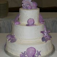 Lake Side Romance 14", 10" and 6" round cake used for this wedding cake. Decorated with buttercream/cream cheese since it was a carrot cake....