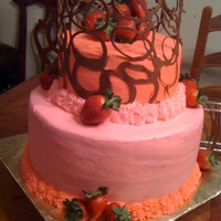 Chocolate Lace Wrap Bday cake for my sister. Tiered chocolate lace wrap with strawberries and bavarian cream filling. This was her request.
