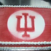 Off To Indiana University this is a 12X18 sheet cake frosted with buttercream. Air brushed with the IU logo and colors.