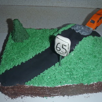 Car Jumping Off Hill This was a chocolate cherry cake with buttercream.