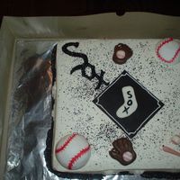 White Sox This was a white cake recipe with lemon curd filling. Covered in buttercream and fondant wording.