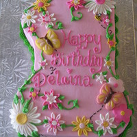 First Birthday Cake Buttercream icing with fondant flowers and chocolate mold butterflies and ladybug