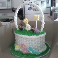 Easter Basket basketweave, grass tip w/ mixed greens for color, handle is fondant but would mix with gumpaste next time couldnt get it to stay up. my...