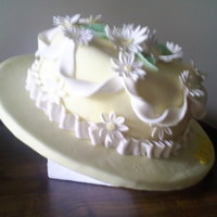Hat Cake first hat cake, covered board in fondant (12") cake is 8 " filled. made flowers from flower cutter, used ball on vein tool to...