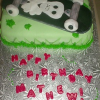 Skateboard Cake Vanilla cake filled with pastry cream. Covered in fondant with skateboard design on top. For 8 yr old boy.