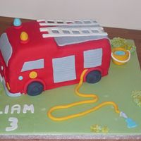 Fire Engine Cake vanilla cake filled with strawberry jam and vanilla buttercream. All cake and accents fondant.
