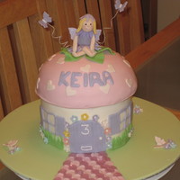 Fairy Toadstoolcake VANILLA SPONGE FILLED WITH JAM AND BUTTERCREAM, COVERED IN FONDANT. THIS WAS MY FIRST ATTEMPT AT MAKING MY OWN FAIRY FOR THE TOP, I THINK...