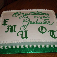 Eastern Michigan Occupational Therapy Graduation White cake, buttercream frosting with the EMU and OT being chocolate molds. Thanks for looking.