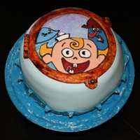 Misadventures Of Flapjack Six layer chocolate cake covered in fondant with royal icing.