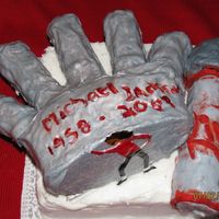 Tribute To Michael Jackson 1958-2009 A chocolate cake that is carved into a hand covered with gray fondant, and I mixed pearl dust and water to give it that shiny look. I did...