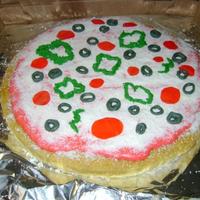 Pizza Cake Pizza cake with chocolate, fondant, and fruit roll-up embellishments.