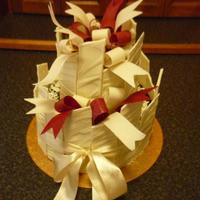 Chocolate Bow With Uneven Shards Cake 2nd cake from "2-tier Special Occasion Cakes" course.Made the bow at home as a separate piece, so it could be removed for cutting...