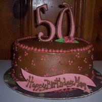 50Th Birthday For a friend's mom for her birthday. Chocolate buttercream (YUM!!!). The flower is fondant. The "50" and banner is gumpaste...