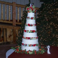 6 Tier Wedding Cake 6 tier wedding tower cake. All cakes were different flavors. Buttercream icing on all cakes. I also did all the flower arrangements for...