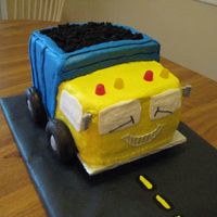 Dump Truck Cake birthday cake for a 2 year old. Mostly buttercream, with donut wheels and cake crumb "dirt". License plate on back had the boy&#...