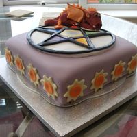 Summer Solstice Cake With Dragon Theme Summer Solstice celebration cake with Dragon theme. Lemon sponge with Orange BC, fondant covered