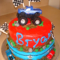 Monster Jam!! I saw this cake made by whitet4 and I did it with some personal touches!. Covered in BC, flags and rocks are gumpaste.