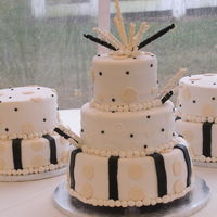 Wedding Cake This wedding cake design was requested by the bride. It was a 400 person wedding and therefore the two smaller satellite cakes were created...