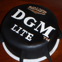 21St Birthday This cake is modeled off of the MGD bottle cap. The birthday boys initials are DGM and the bottle cap was changed to reflect that.