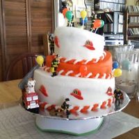 Fireman Topsy Turvy my first attempt - I used icing, but believe fondant will produce a much nicer look!!