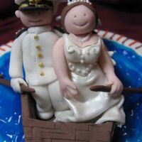 Hokie Cake Closeup A closeup of the bride and groom on my Hokie bridal shower cake. I'm pretty proud of them, especially the groom's Navy uniform....