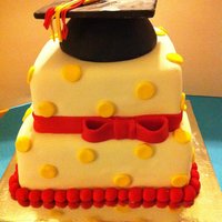 Graduation 10' Choc with whipped choc creme filling8" vanilla bean with fresh raspberry buttercream filling covered in fondant with a RKT...