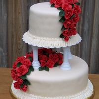 Wilton Course 3 Grand Finale Cake Covered in Wilton fondant tinted ivory, red Satin Ice fondant with added gum-tex roses, BC ruffle border.