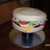 Hamburger Cake I made this for my BIL 21st, Boobie cupcakes were placed around tha bottom. All fondant
