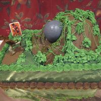 Harry's Indiana Jones Cake Cake for Harry's fourth bday. Indiana Jones figure, pic, and bolder set.