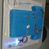 Nurse This cake was made for my niece's last day at work as a medical assistant. The cake was white cake with strawberry filling. All...