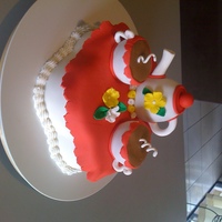 Tea Party Cake made for my daughter's birthday. Carrot cake on bottom. Tea pot and cups red velvet cake. All accents are fondant.