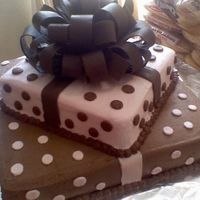 Baby Shower this isnt the best pic...this was for a baby shower. cake is covered in almond bc, bow is made from bark chocolate.