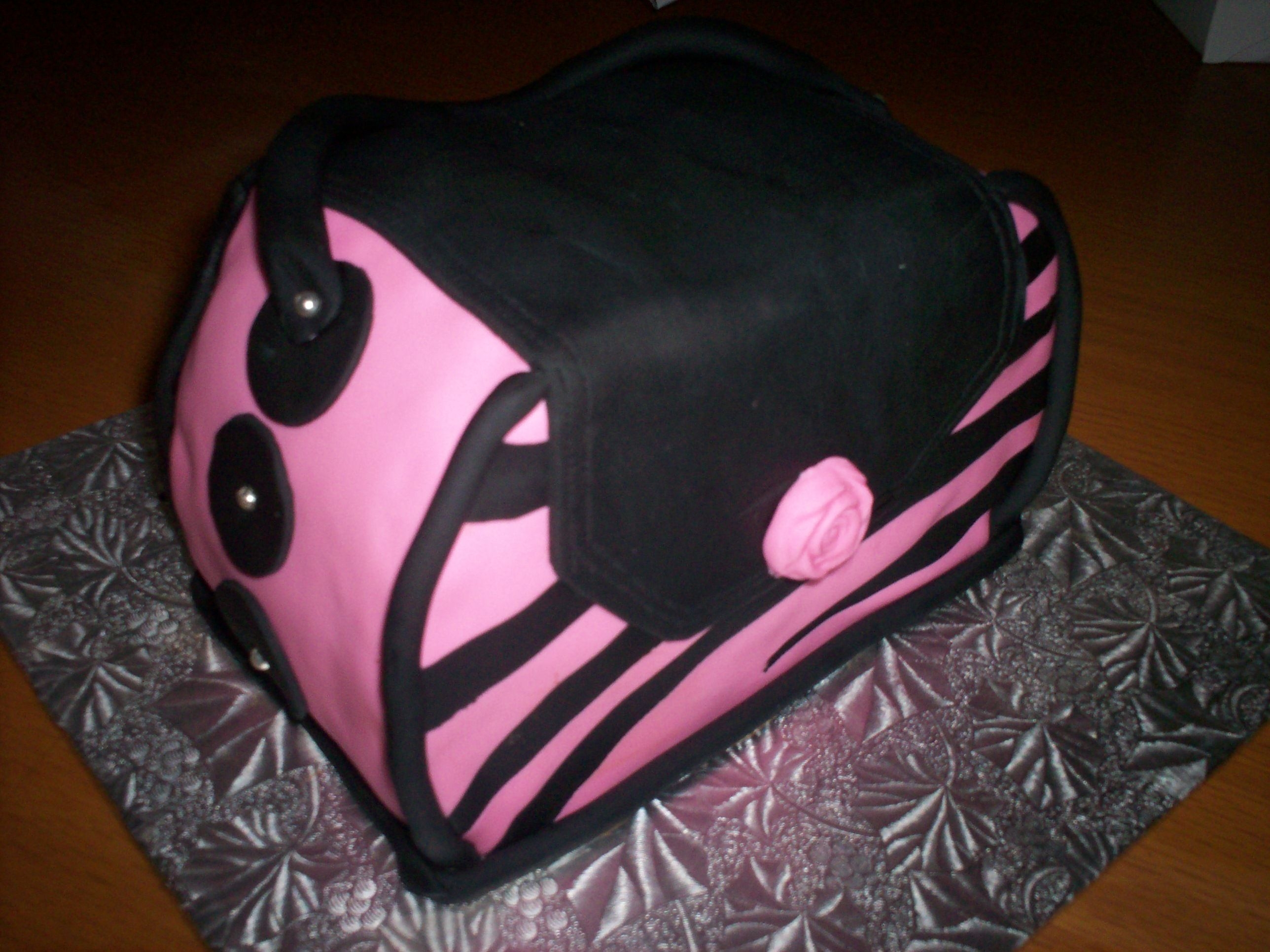 Pink And Black Purse Cake I made this cake real quick. There was an event and a friend's children's school that I wanted to donate a cake to, but only...