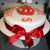 Red Flower Theme Birthday Cake cake for my sons school headmistress - she didnt really know what she wanted, just something red on it lol! So she got this! All fondant...